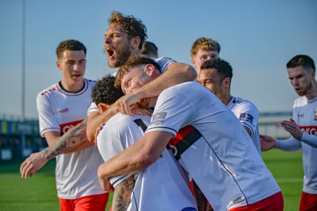 Nathaniel Crofts is congratulated by teammates after scoring