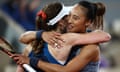 Zheng Qinwen hugs Alizé Cornet after her victory on Philippe-Chatrier Court.