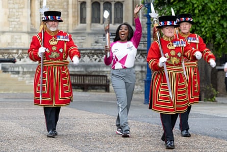 Tessa Sanderson carrying the baton at the Tower of London during the relay for the 2022 Commonwealth Games in Birmingham