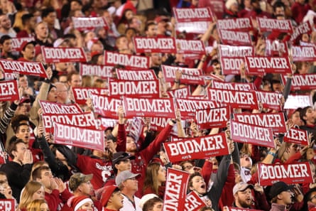 sea of people holding red ‘Boomer’ signs