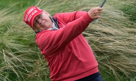 Donald Trump playing a shot on his golf course in Doonbeg, Ireland