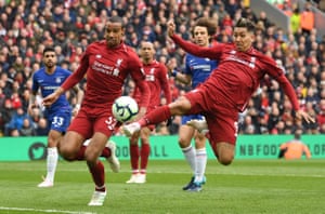 Firmino stretches to prod the ball towards goal.