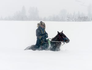 A herdsman makes his way through 1-metre deep snow in north-west China’s Xinjiang autonomous region