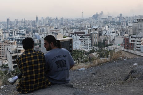 A view of Tehran, with smoke billowing in the background.