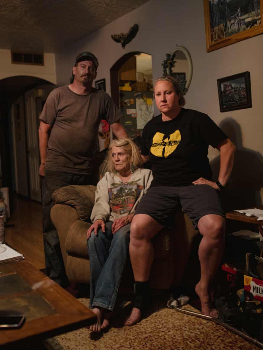 Stoney stands while Samantha and Brandy sit on armchair
