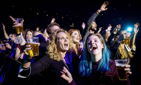 Visitors to the Ziggo Dome attend a performance by Dutch singer Andre Hazes part of a series of trial events in which Fieldlab is investigating how large events can take place safely in corona time in Amsterdam on 7 March 2021