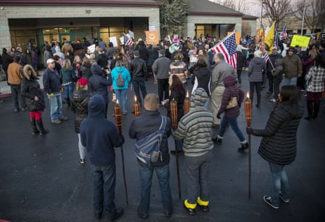 Anti-maskers, some carrying tiki torches, protest at the Central District Health offices during a special meeting of the board to decide on new mask mandates Friday, 4 December, 2020 in Boise, Idaho.