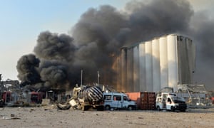 Smoke billows from harbor area with damage and debris after a large explosion rocked the harbor of Beirut, Lebanon, 4 August 2020.