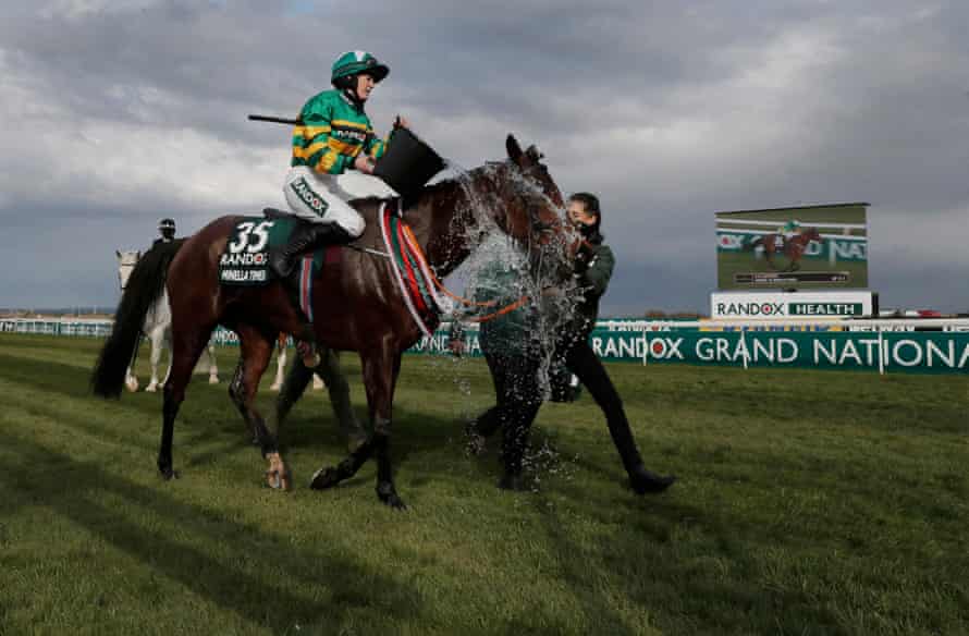 Rachael Blackmore pours water over Minella Times after winning the Grand National on day three of the Grand National racing festival 2021 at Aintree on April 10th 2021.