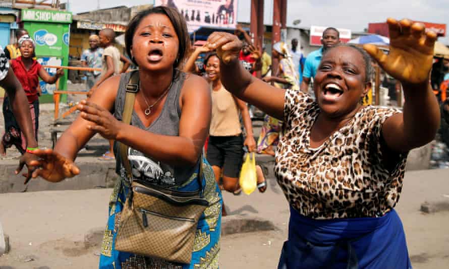 Residents chant slogans against President Joseph Kabila during demonstrations in the streets of Kinshasa.