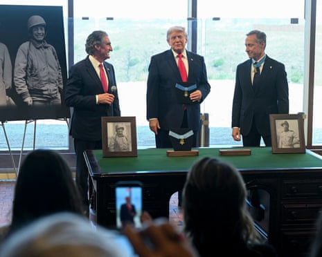 Doug Burgum. Donald Trump and Britt K Slabinski, president of the Congressional Medal of Honor Society, at the newly opened Theodore Roosevelt Presidential Library in Medora, North Dakota, on 1 July 2026.