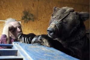 Volgograd, Russia. Animal tamer Pavel Kudrya with one of the two bears he has been keeping at his home since their show was cut from the Russian State Circus Company