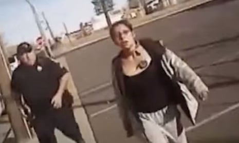 In body-camera footage, Loreal Tsingine is seen getting up and walking toward an officer with a small pair of scissors in her left hand, and another officer quickly approaches her from behind.