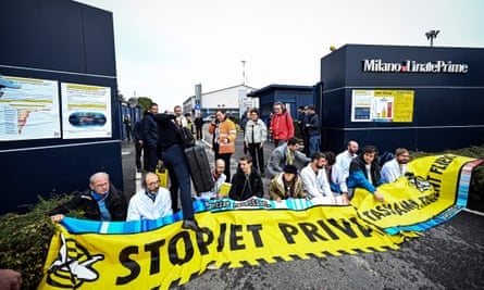 Activists from Extinction Rebellion, Scientist Rebellion and Last Generation blocking the entrance of an airport facility in Milan.