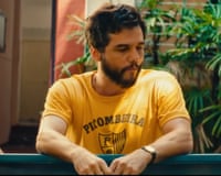 a man in a yellow shirt