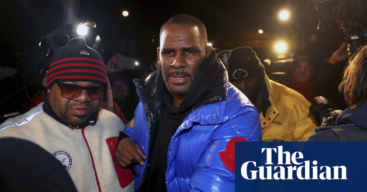 R Kelly in police custody after being charged with 10 counts of sexual abuse