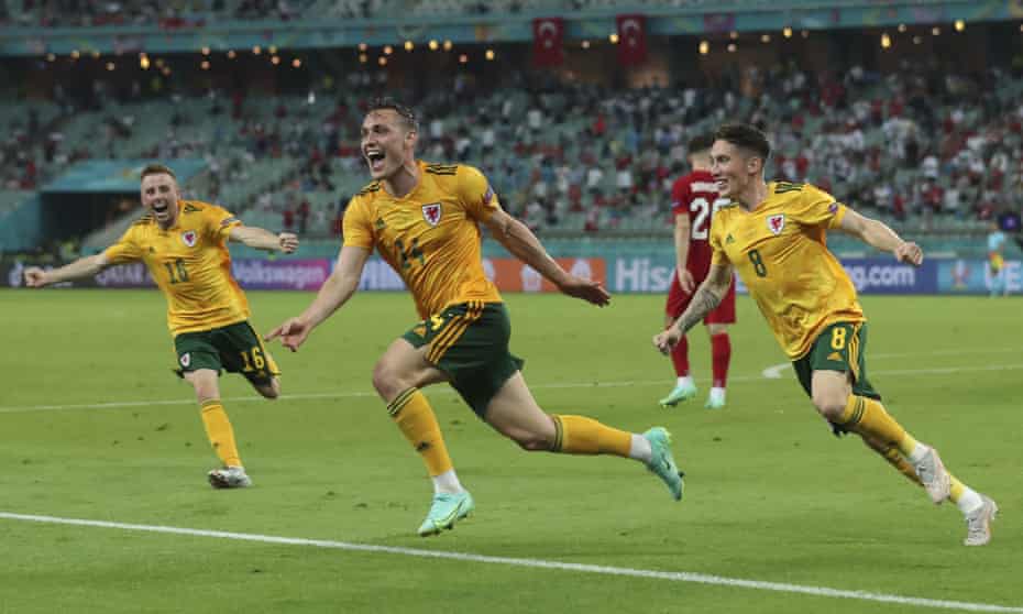 Connor Roberts (centre) celebrates after scoring Wales’ second goal against Turkey.