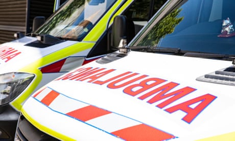 Close up of two ambulances parked next to each other