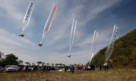 Members of Fighters for Free North Korea, an organisation of defectors from North Korea, send balloons carrying anti-Pyongyang leaflets across the border from the South Korean border city of Paju