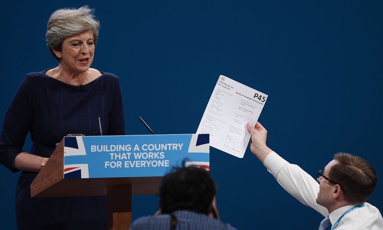 ‘It’s an extraordinary form of comedy that can fast-track you to the front pages’ … Simon Brodkin hands Theresa May a P45 during the 2017 Conservative Party Conference.