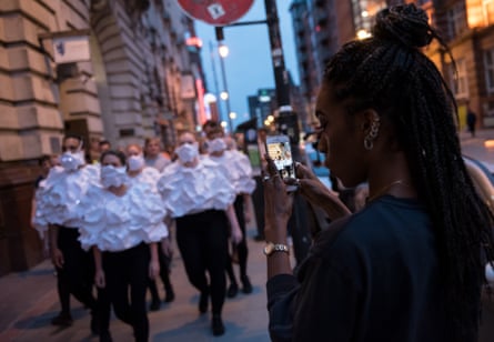 Kasia Molga and performers on the streets of Manchester.