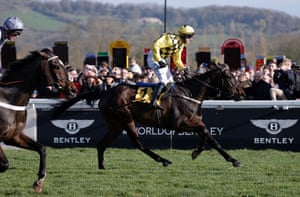 Paul Townend crosses the finishing line on Al Boum Photo to beat Santini (left) and win the Gold Cup for the second consecutive year.