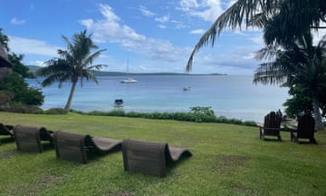 Empty banana chairs facing the ocean in Vanuatu