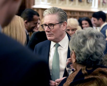 Keir Starmer in a room full of people