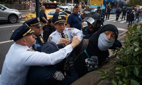 Police arrest a pro-Palestinian protester during the Met Gala.