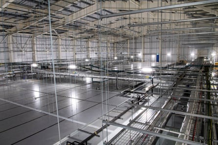 A large, grey, bare warehouse.