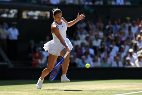 Marta Kostyuk plays a forehand against Jasmine Paolini.