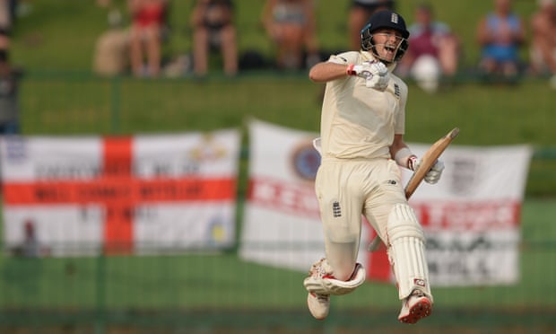 Joe Root leaps, punching into the air, after his century in the second innings against Sri Lanka on Friday.