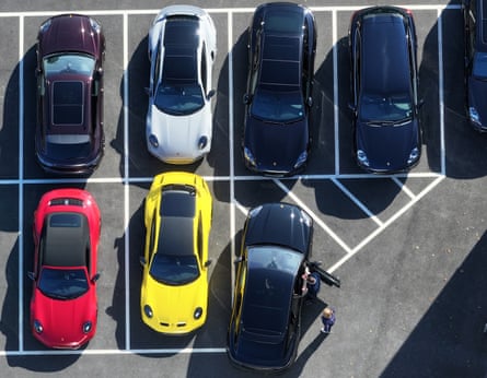 Aerial view of new and secondhand cars are seen for sale on a dealership forecourt