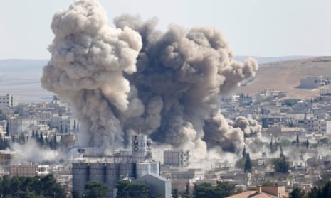 Smoke rises from the Syrian town of Kobani, which is less than a mile from the Turkish border.