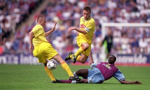 Welcome to the Hawthorns: Ian Taylor puts in a slide-tackle against Marila Pribram.