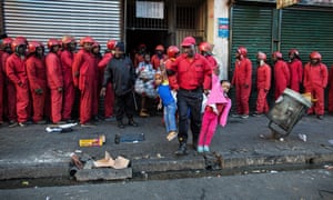 The Red Ants evict residents of a so-called hijacked building in Bree Street, Johannesburg.