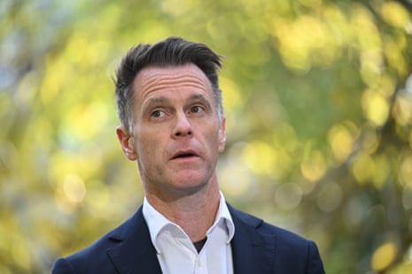 A man with short hair in a dark suit.