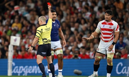 Samoa’s Ben Lam is shown a red card against Japan.