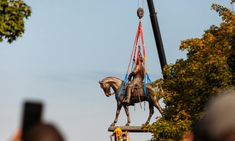 The statue of Lee is removed in Richmond. Crews began work before 8am on Wednesday.
