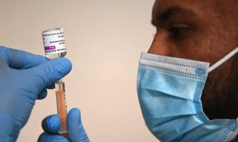 A pharmacist prepares the Oxford/AstraZeneca Covid19 vaccine at an NHS vaccination centre in Ealing, west London.