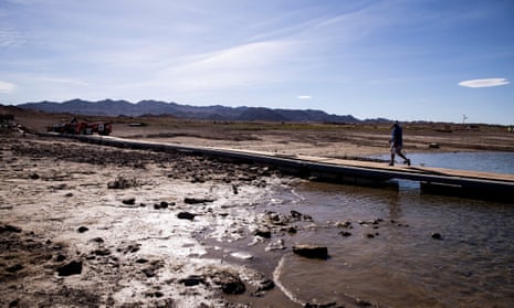 A man exits the marina walking on an access ramp on Lake Mead, near Boulder, Nevada.