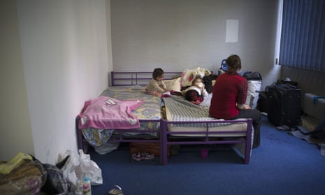 A women with her children in an emergency shelter.