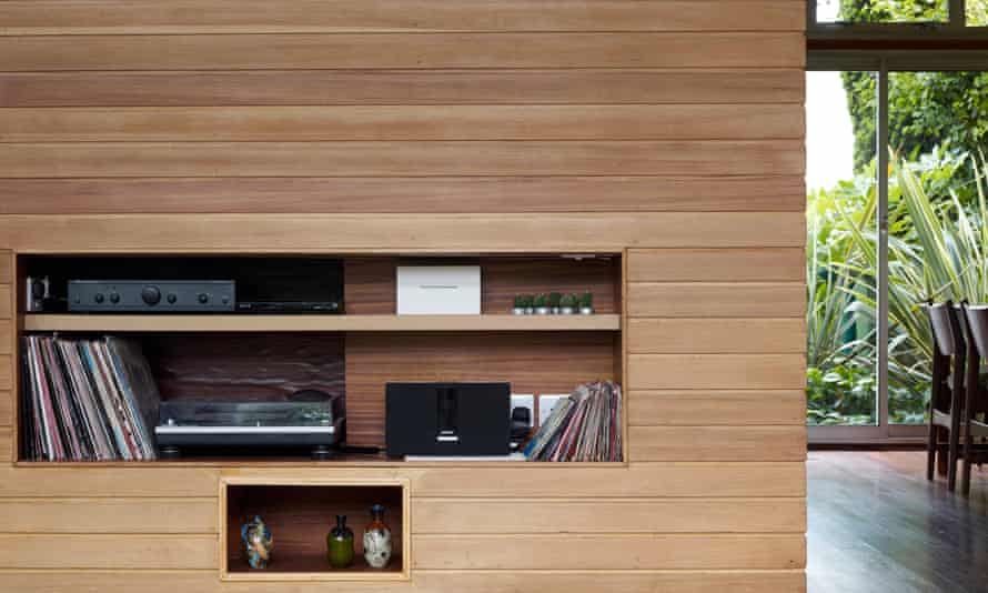 A pine half wall built to house a TV and hi-fi.