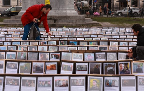 Activists install photo frames during a visual protest titled 'Iran's Exhibition of Death 2,' in which 500 photo frames display portraits of some of the thousands of protesters killed by the regime during recent waves of violent repression in Tehran, at Place du Luxembourg opposite the European Parliament in Brussels, Belgium, 05 February 2026.