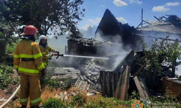 Firefighters douse a house following shelling in the Mykolaiv region this week.
