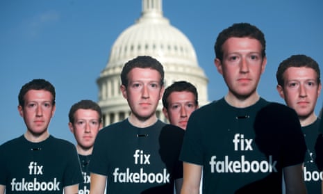 One hundred cardboard cutouts of Facebook founder and CEO Mark Zuckerberg stand outside the Capitol in Washington.