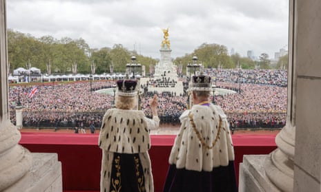 The king and queen greet the crowd from the balcony of Buckingham Palace yesterday.