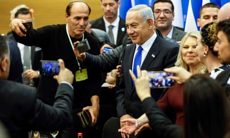 Benjamin Netanyahu attends a toast after the new government was sworn in at the parliamenton 29 December.