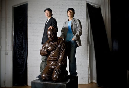 Sculpture of Mao Zedong kneeling with Gao Zhen, left, and Gao Qiang standing beside it