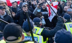 Protesters clash with police who hold raised batons